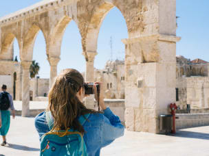 Tourist takes a sightseeing stroll and take pictures amid the upturn in the travel sector
