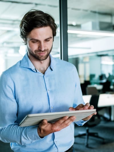 A man looking at a tablet