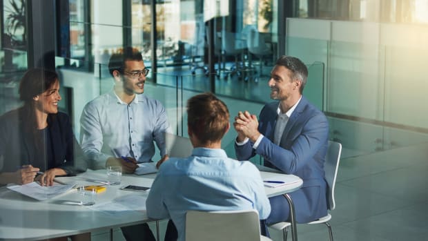 Group of employee workers in business meeting, team planning or collaboration at the workplace