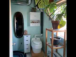 Bathroom with sink and shower.